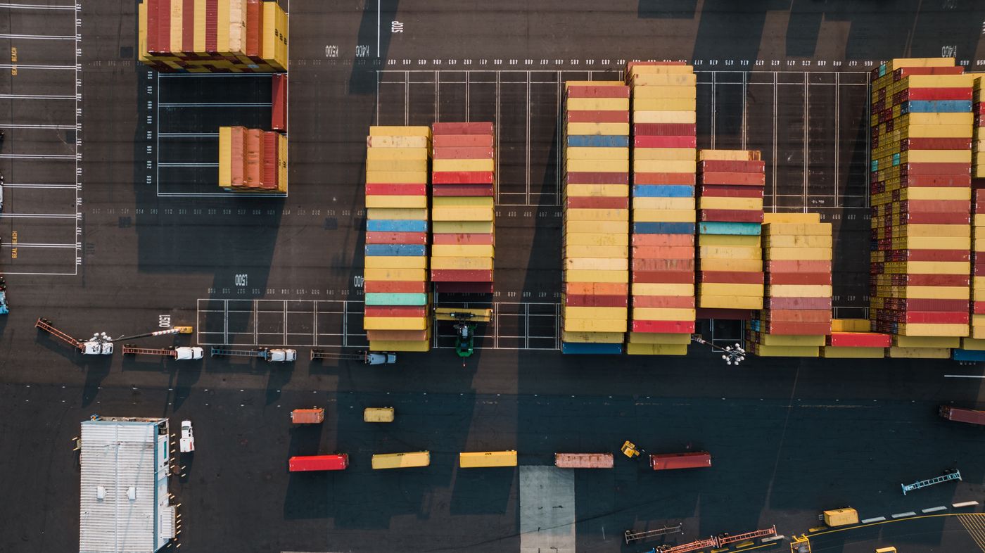 Aerial view of organized shipping containers at a port